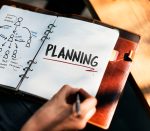 Woman Writing and Planning Business Strategy
