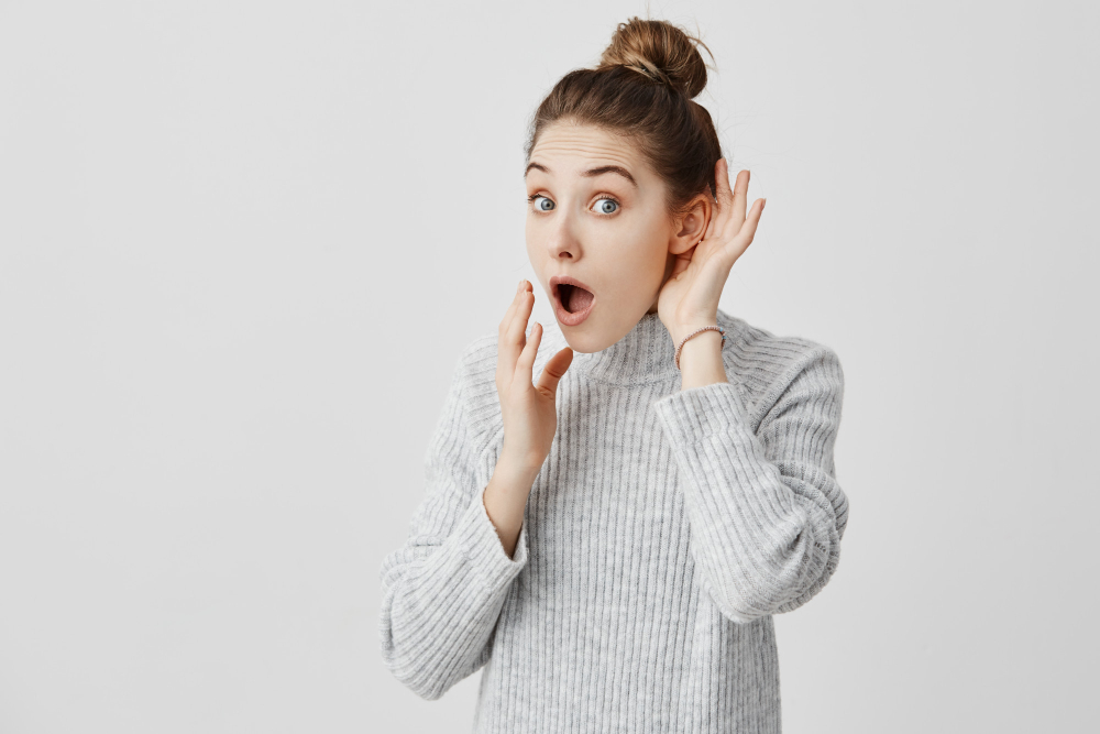 Woman With Hair in Bun Listening To Something
