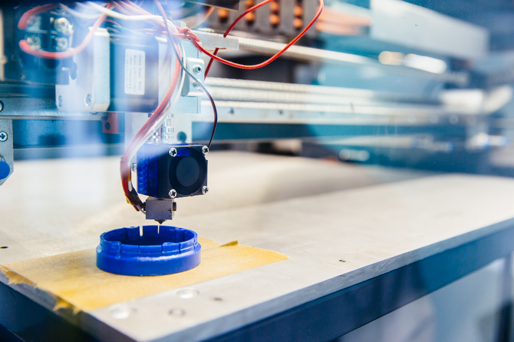 Freshly Printed Blue Plastic Detail on the Platform of 3D Printer 