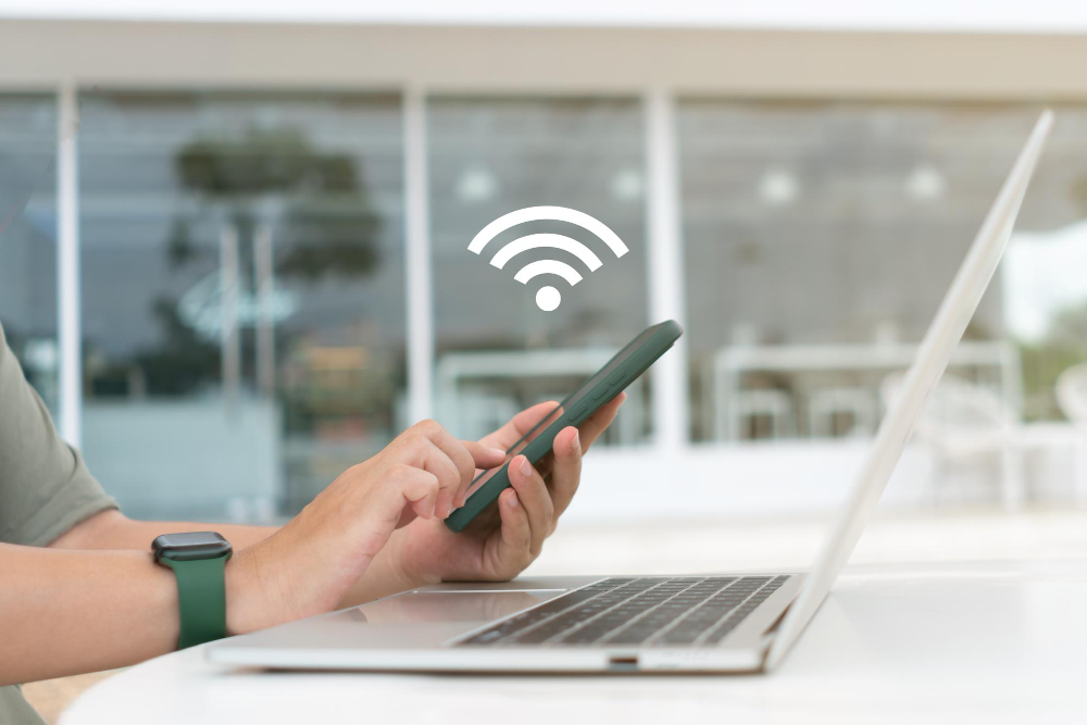 In a Cafe Shop Background a Woman Uses a Laptop With a WiFi 